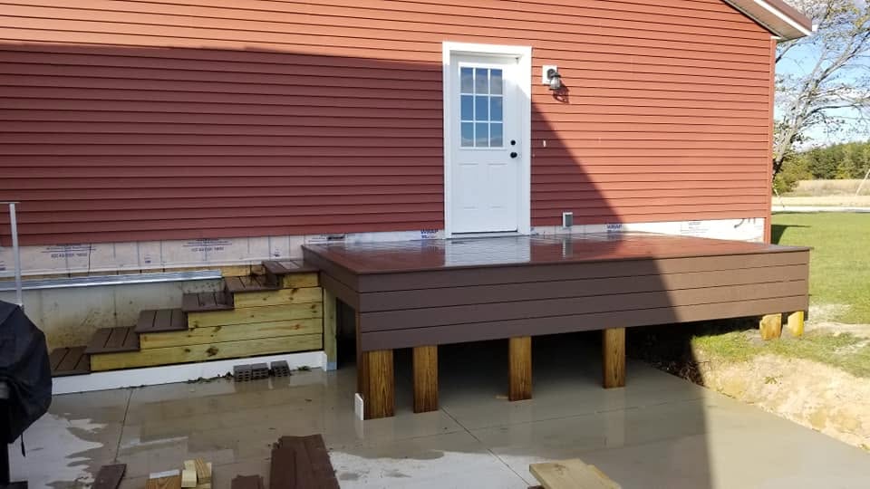 Deck at the back door — concrete patio