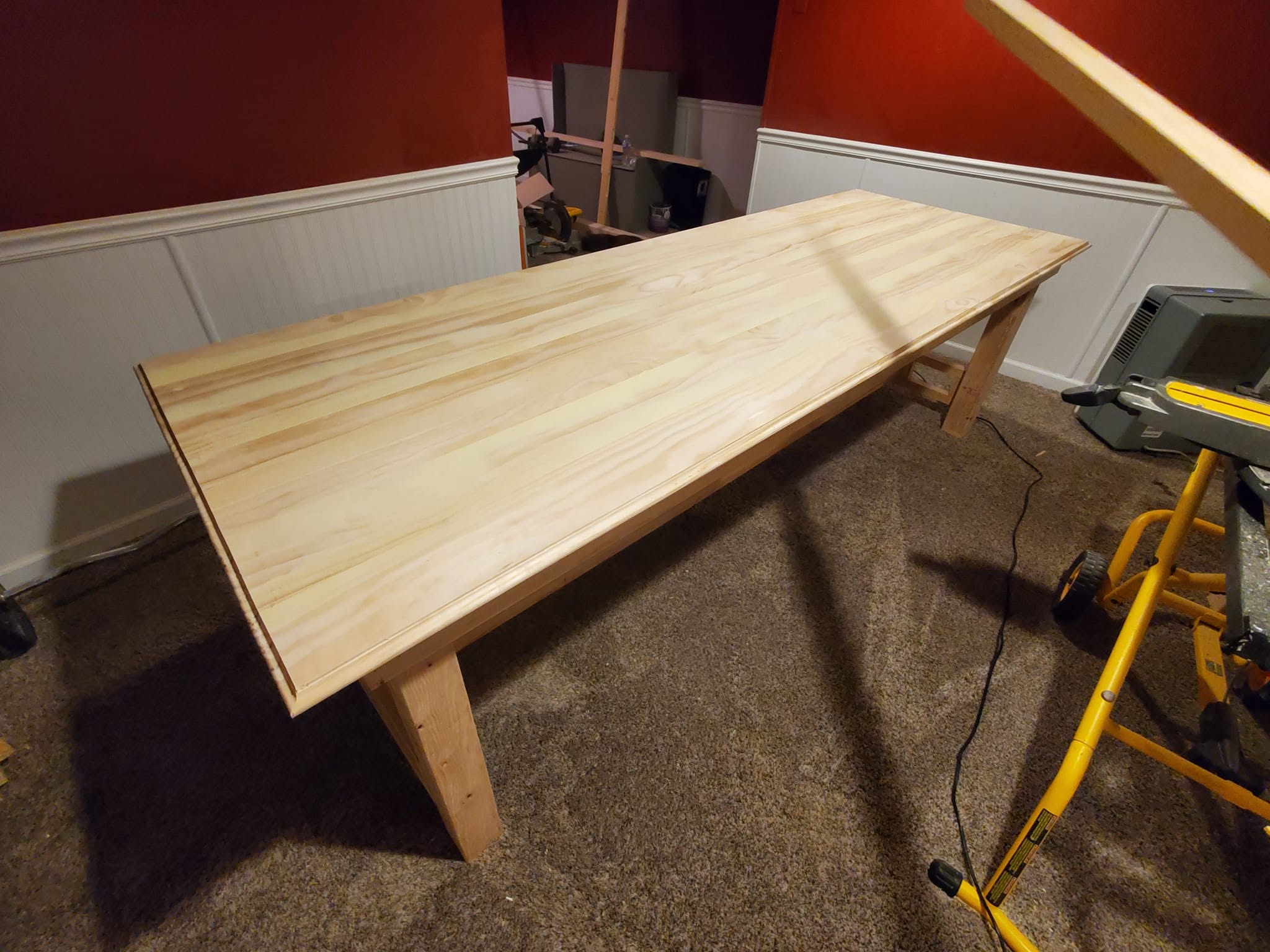 Solid 9-foot dining table built by Nick and Keaton