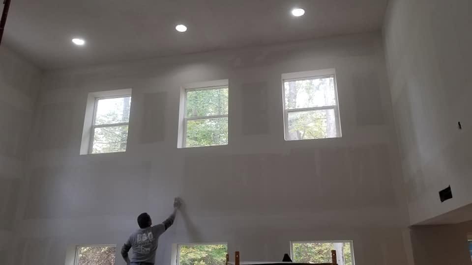 Drywall finishing — tall wall, high windows
