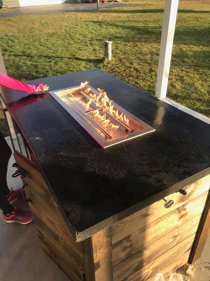 Fire table burner lit, seen from above