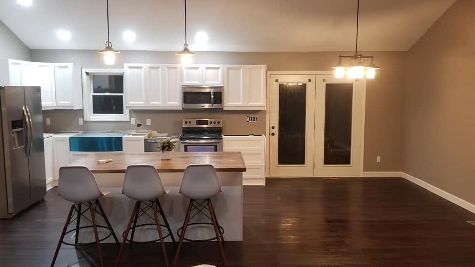 Kitchen with island and bar stools